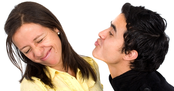 woman rejecting kiss from man
