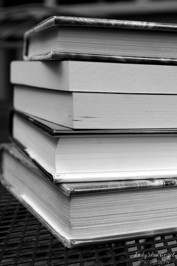 black and white picture of books stacked together aesthetic design instagram