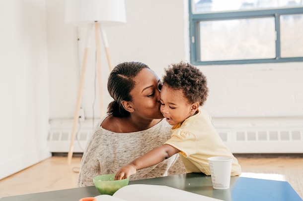 Black woman looking after her child